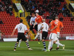 Alex Lacey narrowly misses the ball