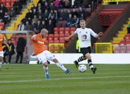 Luke Guttridge tries a shot