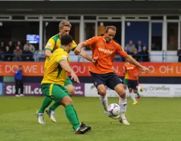 Paul Benson takes on a couple of defenders