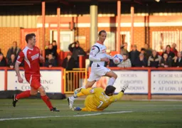 Paul Benson dinks the ball over the goalkeeper