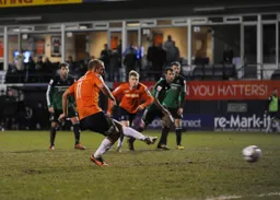 Jake Howells scores from the spot for the fifth goal