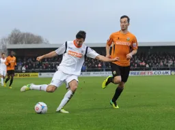 Jonathan Smith runs the ball down the pitch