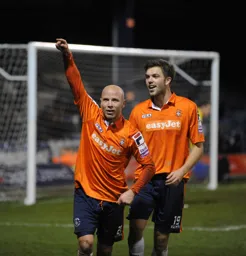 Luke Guttridge in celebration after scoring the final goal of the game