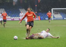 Paul Benson tries to avoid the tackle