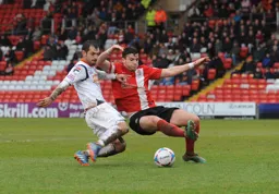 Alex Lawless challenges for the ball