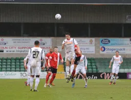 Ronnie Henry heads the ball away