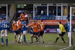 Ryan Inniss powers a header goalwards