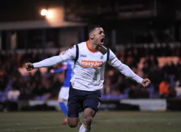 Andre Gray celebrates scoring the winner