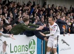 Paul Benson celebrates with the supporters
