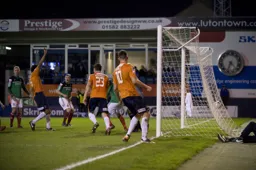 Anthony Charles with his arm up in celebration following an own goal from Neil Ashton