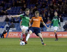 Ian Rees wins the challenge for the ball