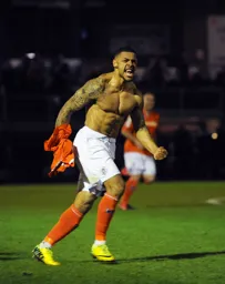 Andre Gray celebrates scoring the winner