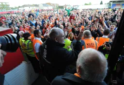 John Still and a pitch full of happy Hatters after the final whistle