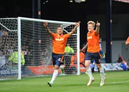 Andre Gray celebrates scoring
