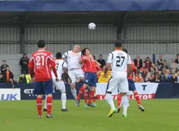 Steve McNulty wins a header