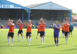 the players acknowldge the fans after winning our first game back in the Football League