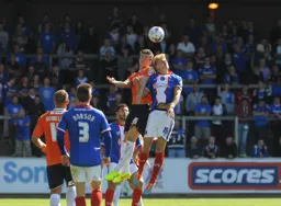 Alex Lacey wins an aerial duel