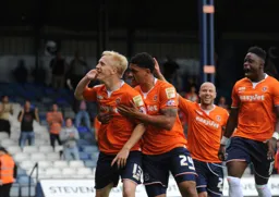 Goalscorer Mark Cullen is congratulated by Curtley Williams
