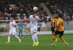 Alex Lacey heads away