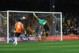 Jonathan Smith watches Luke Wilkinson's header beat the keeper