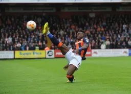 Pelly Mpanzu stretches for the ball