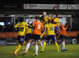 Scott Griffith rises watched by Paul Benson