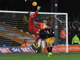 Mark Cullen puts the Mansfield keeper under pressure