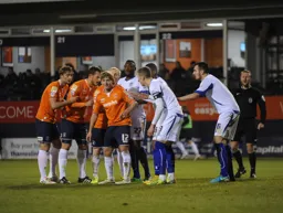 Scott Griffiths enjoys a joke as they wait for a corner