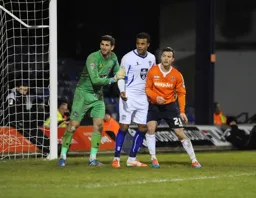 Shaun Whalley is closely marked