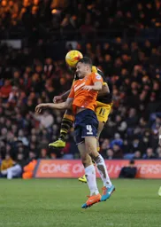 Jonathan Smith duels in midfield