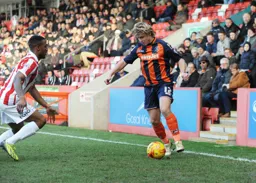 Scott Griffiths takes on a defender