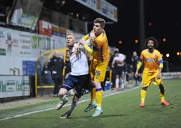 Jayden Stockley holds off a defender