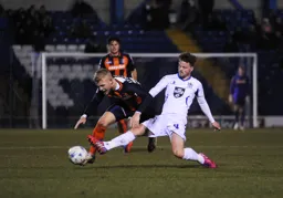 Jayden Stockley watched by Jonathan Smith