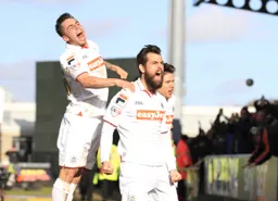 Alex Lawless celebrates his goal WITH Lewis Kinsella