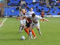 Jayden Stockley tussles with his marker