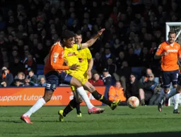Nathan Oduwa tussles for the ball