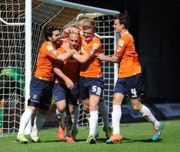 Jakes Howells is congratulated after putting away his penalty