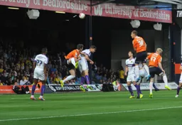 Luke Wilkinson's header is goal bound