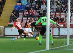 Jake Howells fires in a cross