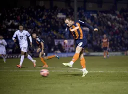 Ricky Miller fires in a shot