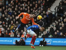 Luke Wilkinson wins a header