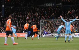 Mark Tyler denies a goal from Cameron McGeehan.
