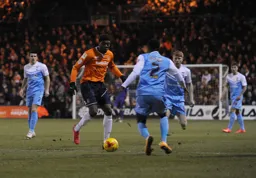 Nathan Oduwa attacks his man