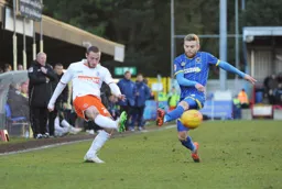 Michael Harriman puts in a cross