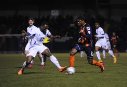 Nathan Oduwa takes on a defender
