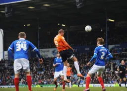 Paul Benson heads goalwards