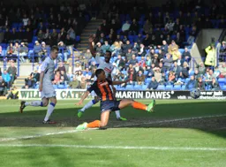 Ryan Hall stretches for the cross