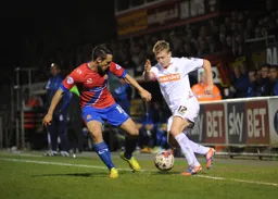 Scott Griffiths runs at a defender