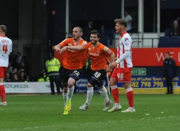 Michael harriman celebrates his goal