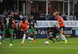 Cameron McGeehan tries to force his way through